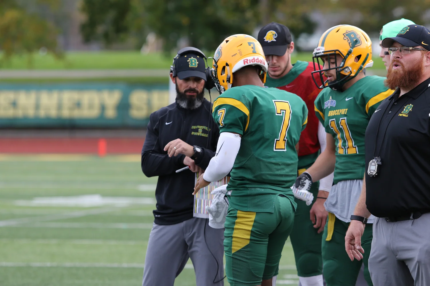 Coach giving instructions on the sidelines