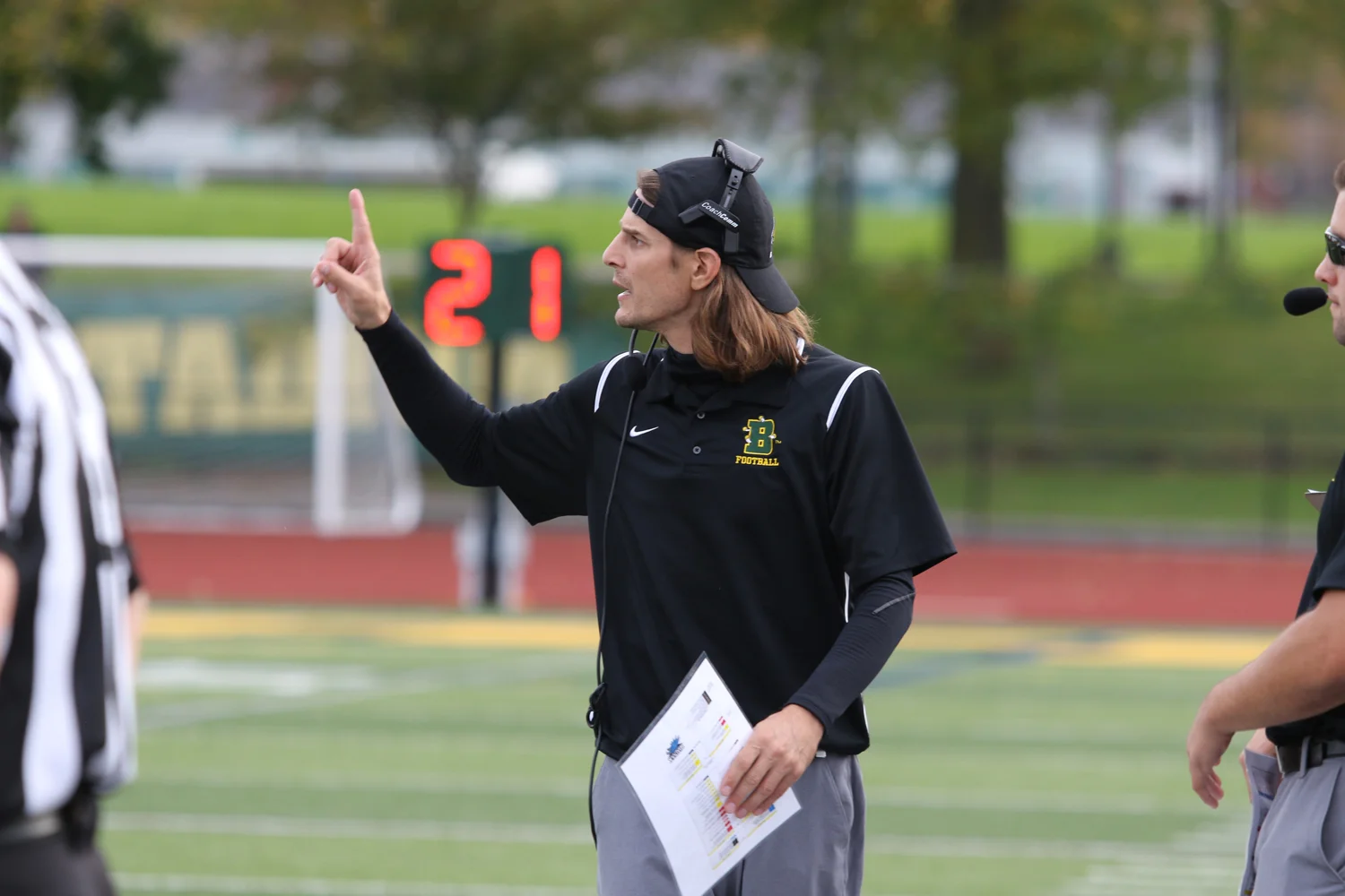 Coach giving signals to the defense