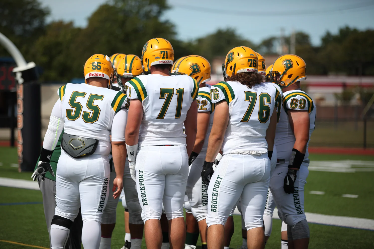 Brockport OL Huddle before the game starts