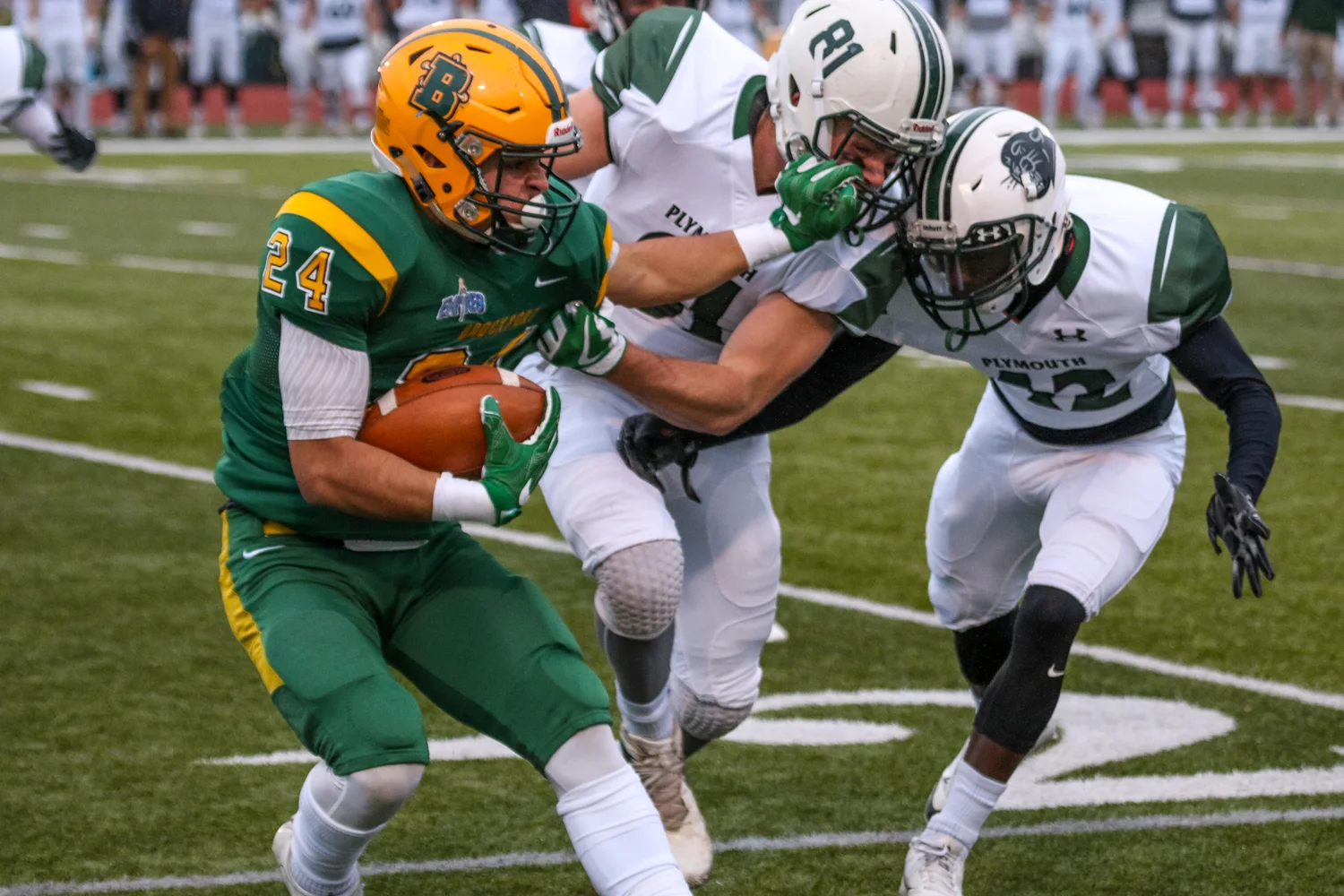 WR fighting for more yards against the Plymouth State defense