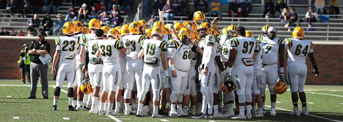 Brockport Golden Eagless huddle during pregame