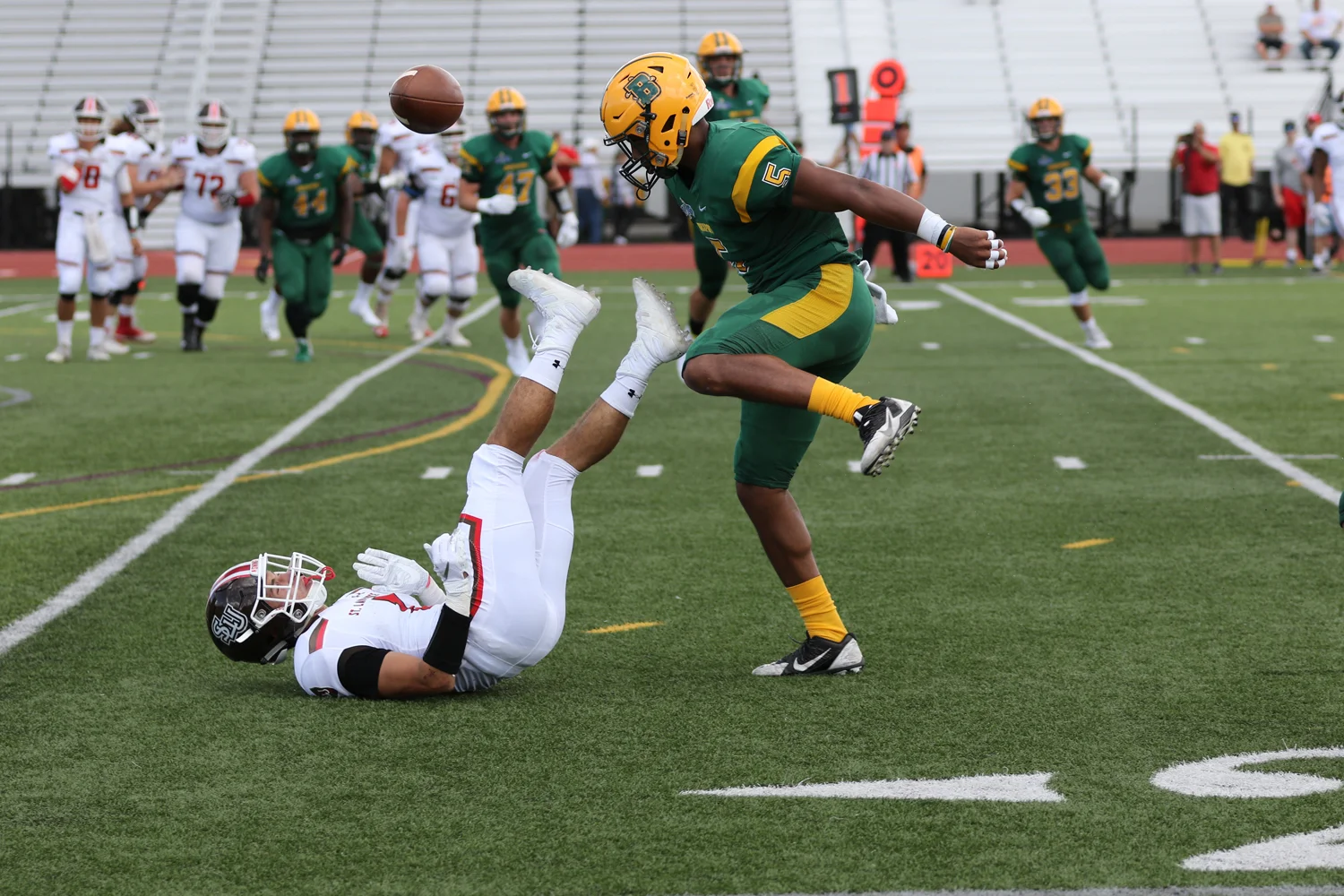 Brockport DB making the hard hit to force the fumble