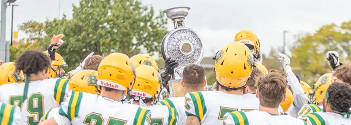 Brockport celerating with the trophy after the victory