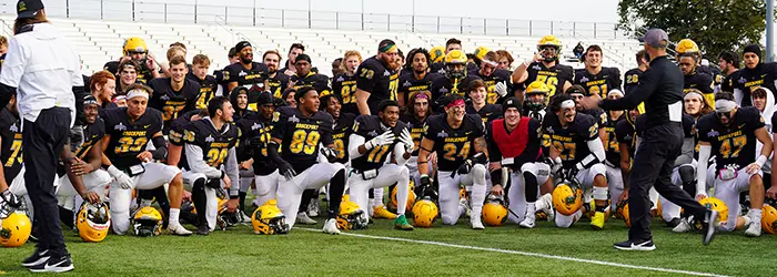 Brockport Team Huddle after the win against Hartwick