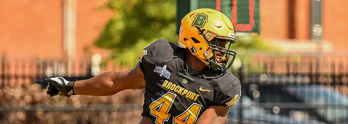 Brockport defensive lineman looking back at the sack in the backfield