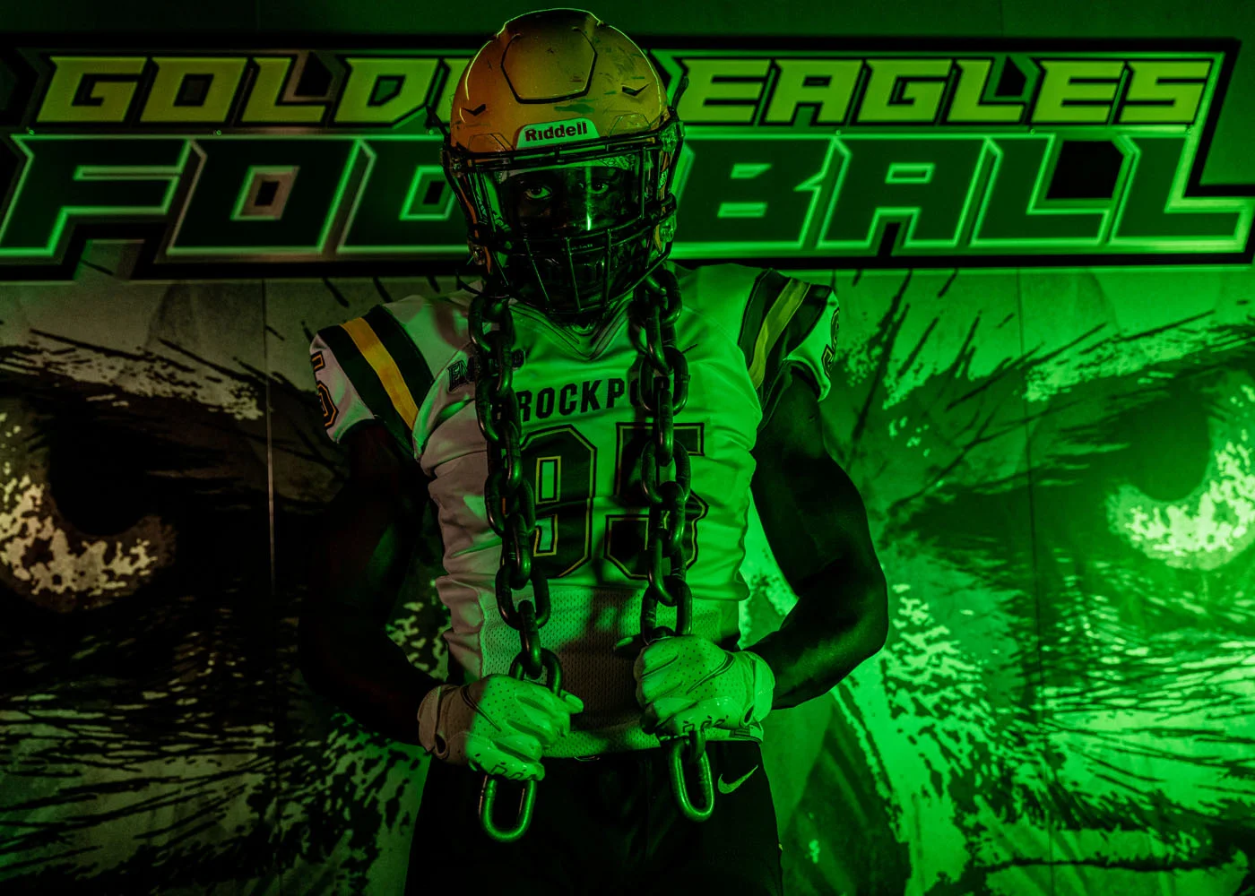 Brockport player Holding the chain on media day