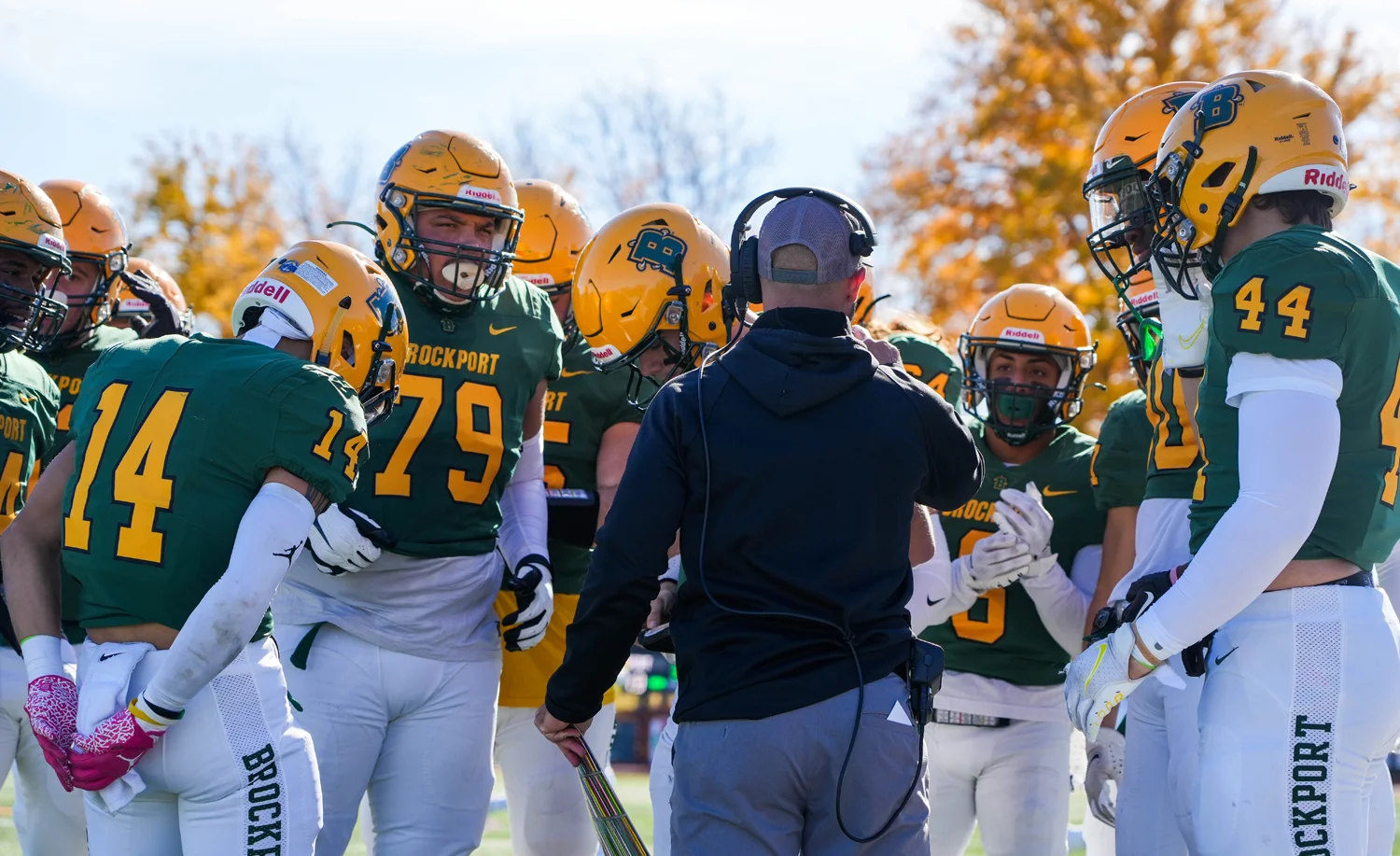 Coach Mangone talking to the offense before they hit the field