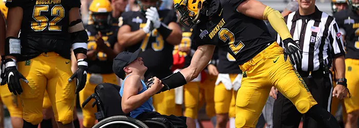 Brockport Player meeting Jay on the sidelines