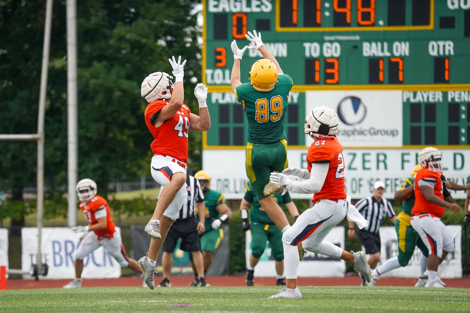 WR and DB going up for the ball