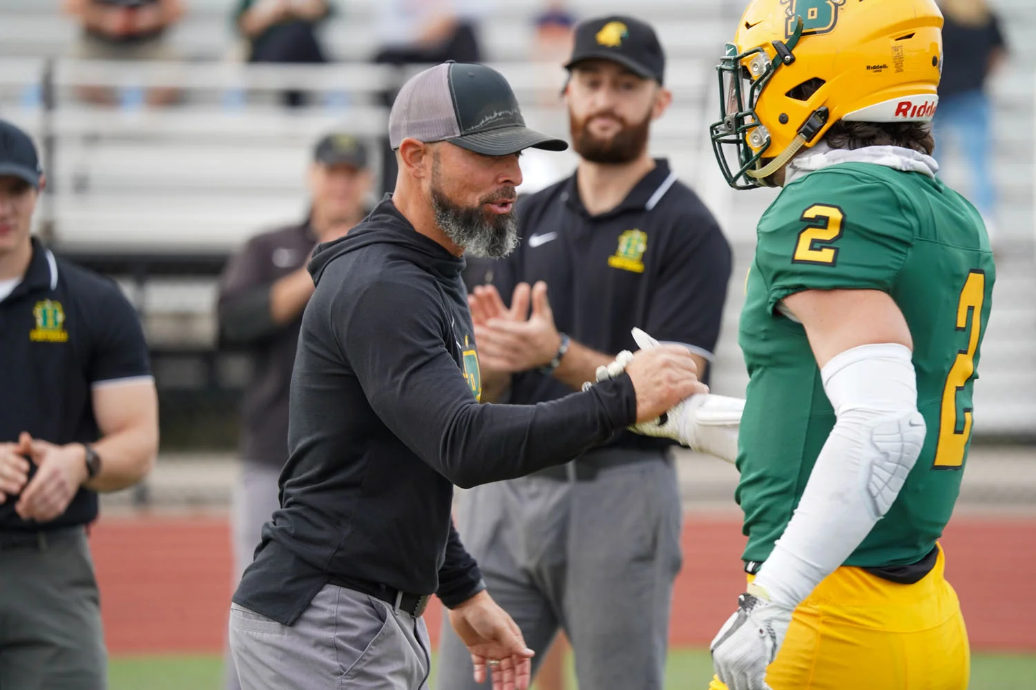 Coach Mangone Congrtulating Brockport Senior