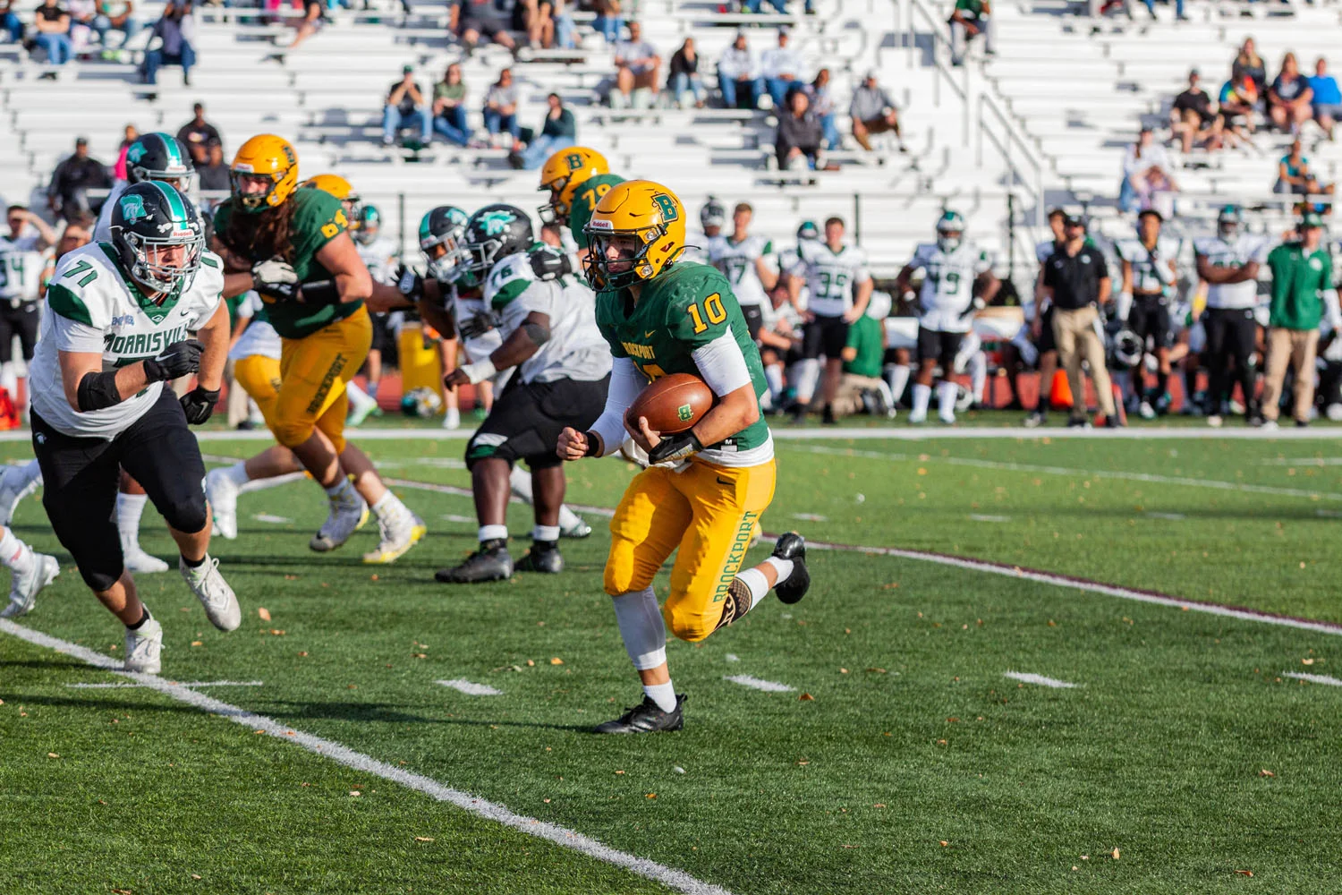 Brockport QB running the ball to open space