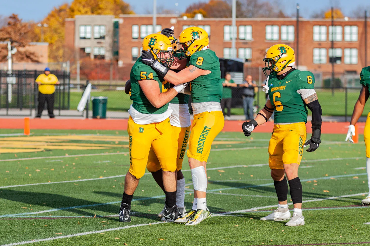 Brockport defense celebrating the sack against Morrisville