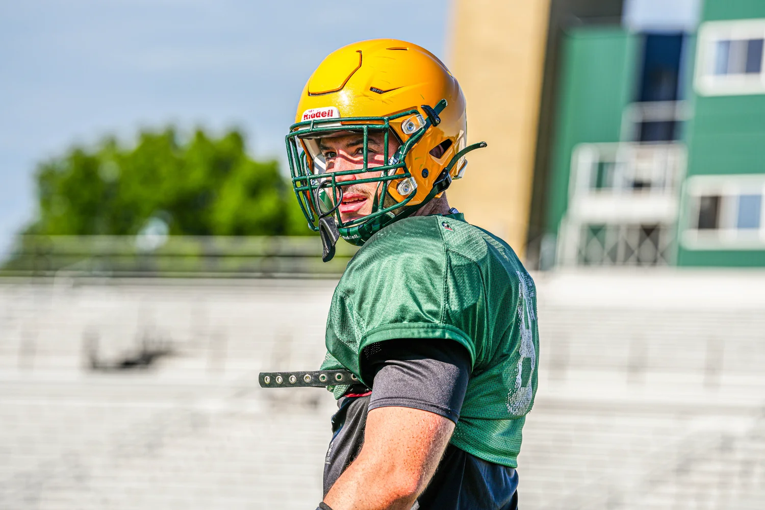 Brockport Football player watching his teammates