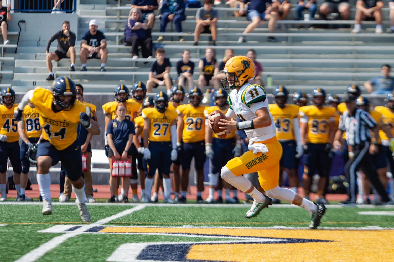 QB running away from the defense