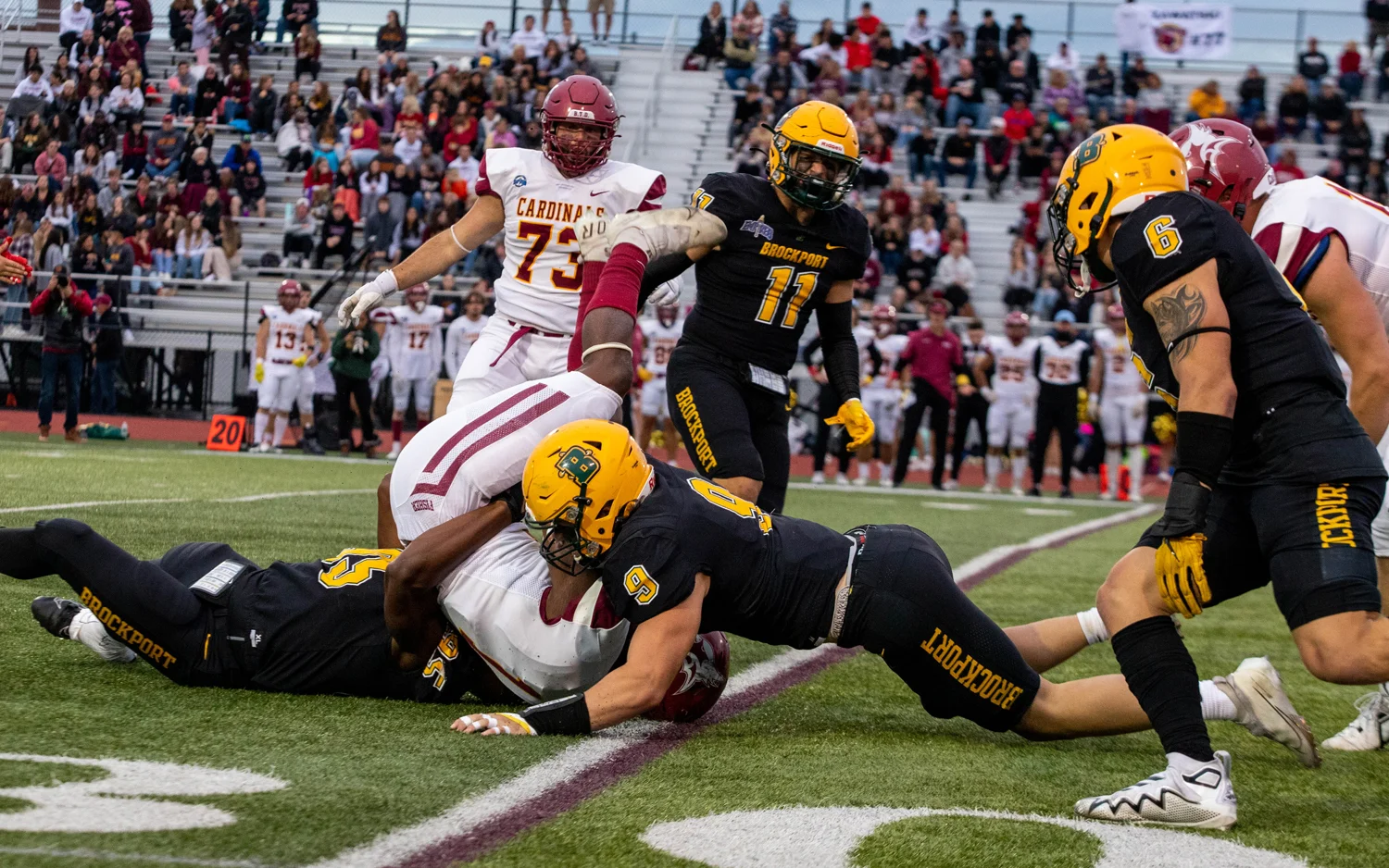 Brockport upends the RB and tackles him