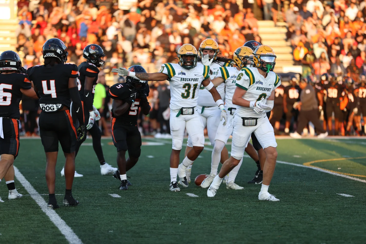 Brockport RB pointing for the first down