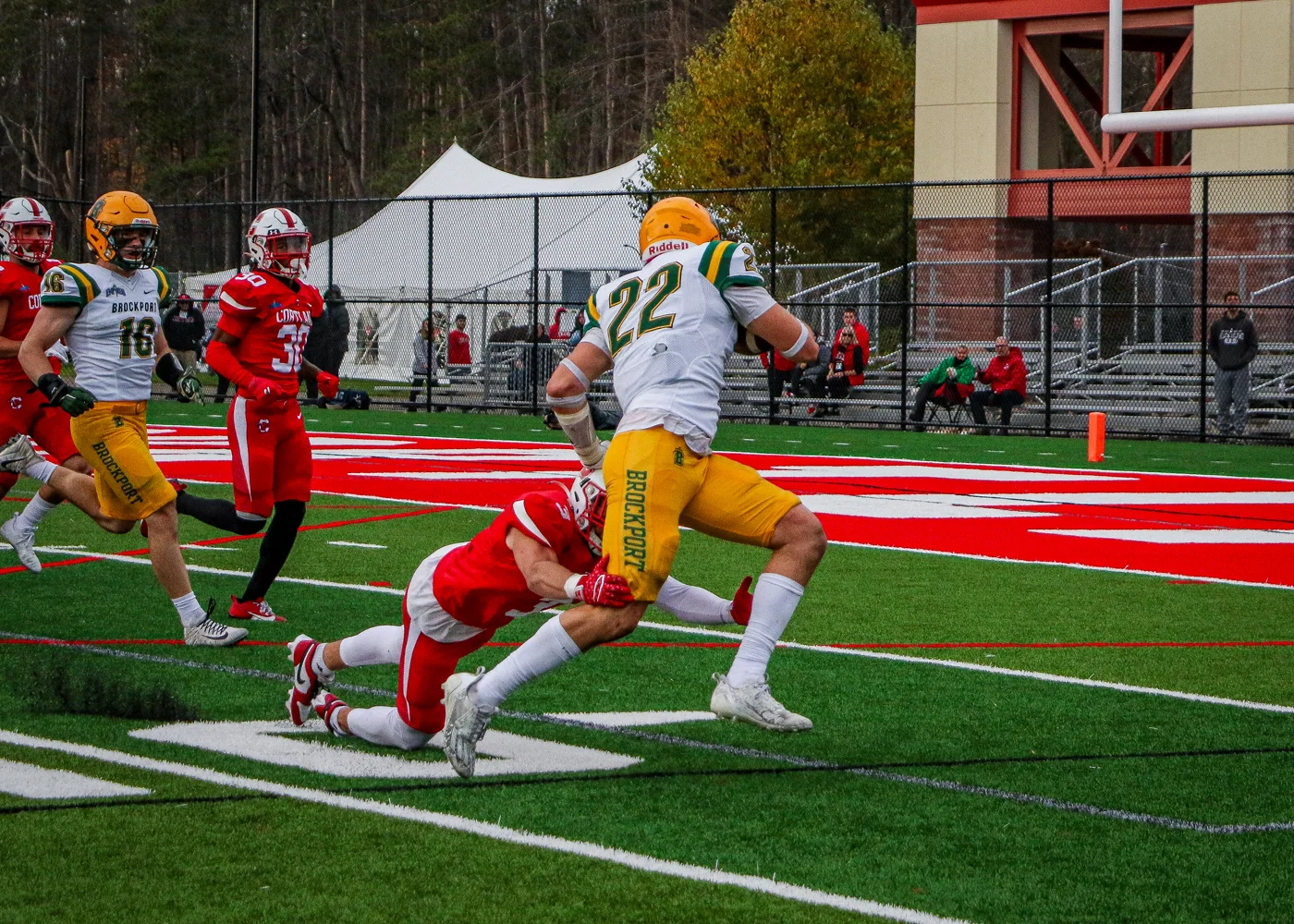 Running the ball to the endzone for a TD