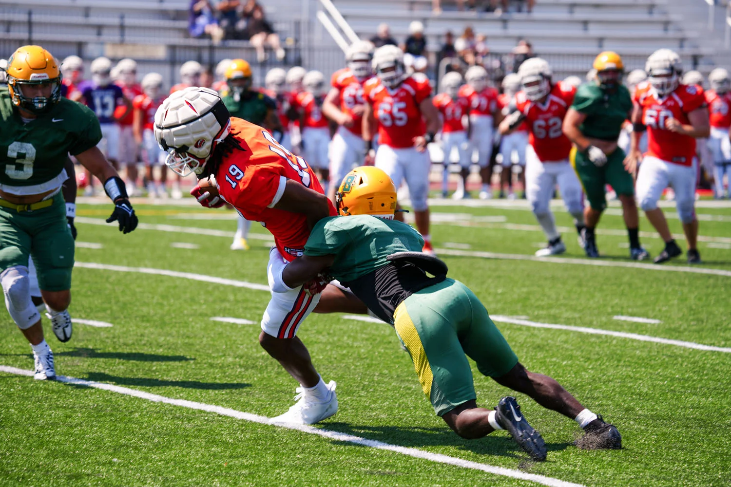 Brockport DB making the tackle on the WR