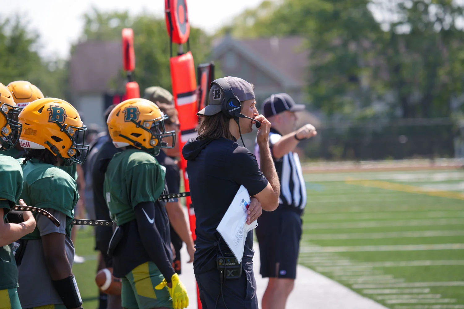 Defensive Blahowicz talking on the headset for Brockport