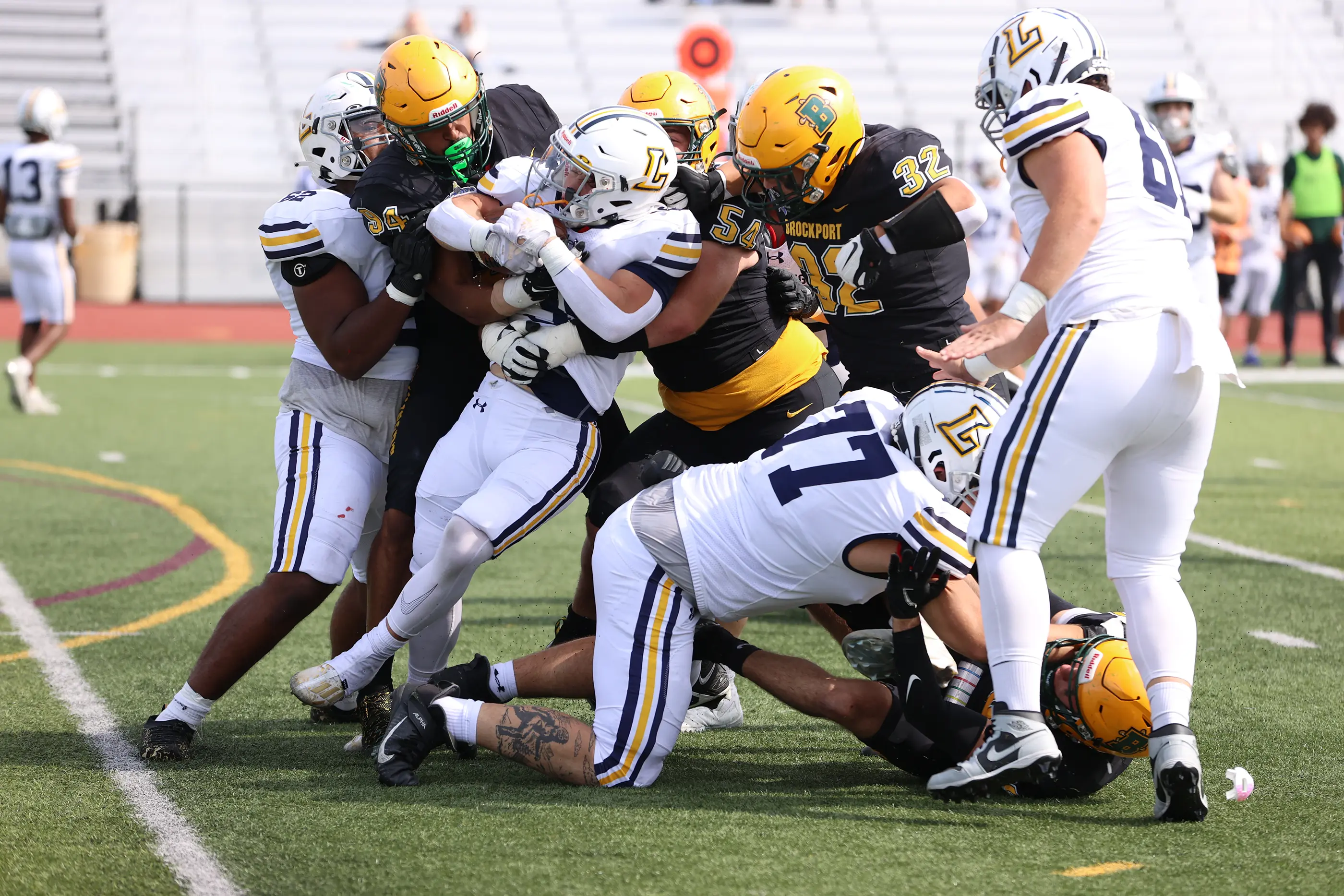 Brockport Football making the stop on defense against Lycoming