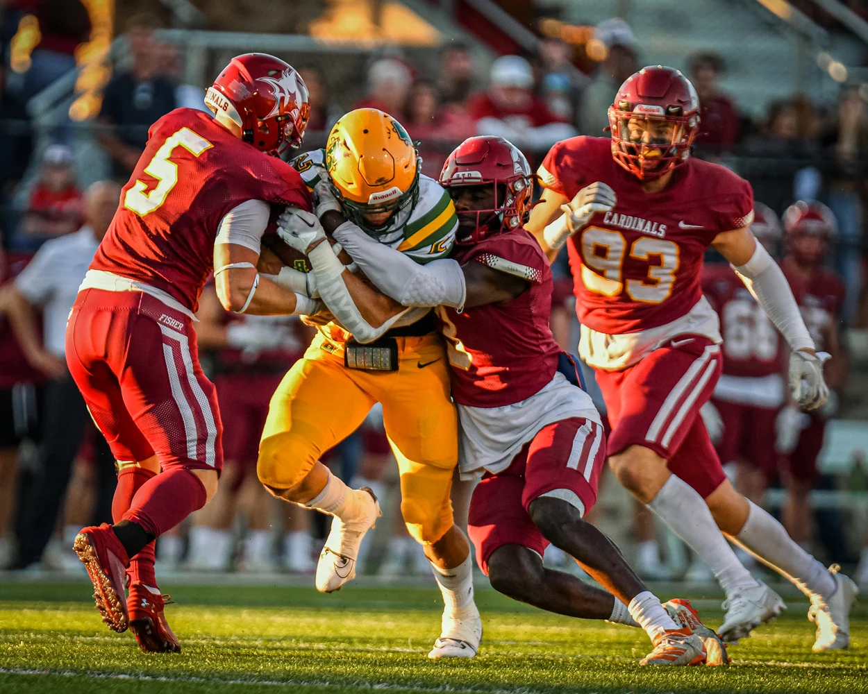Brockport RB pushing through the defense