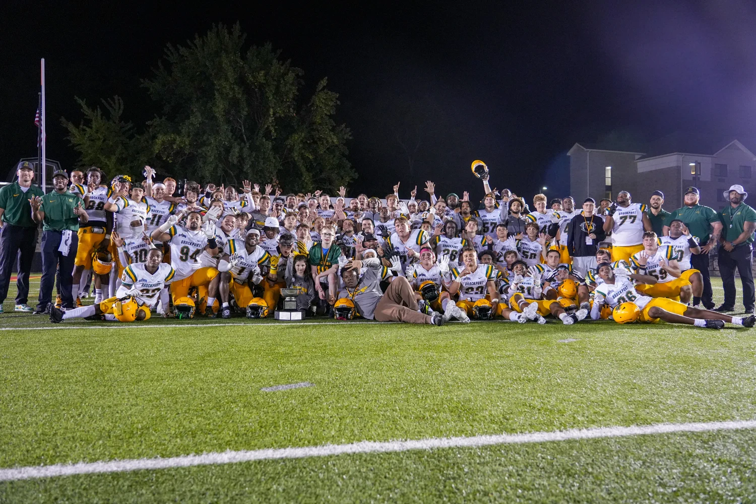 Brockport Golden Eagles pose with the hardware as the victors