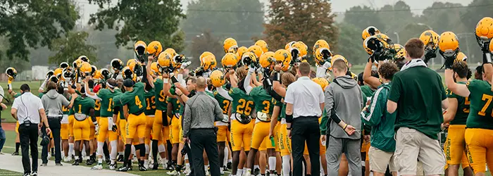 Brockport Golden Eagles with their helmets up