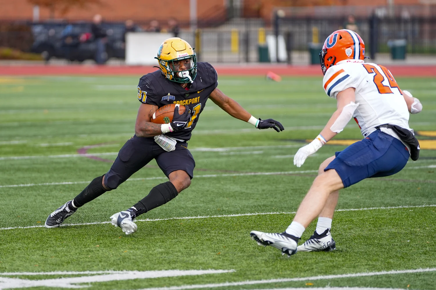 RB looking to shake the defender on the edge