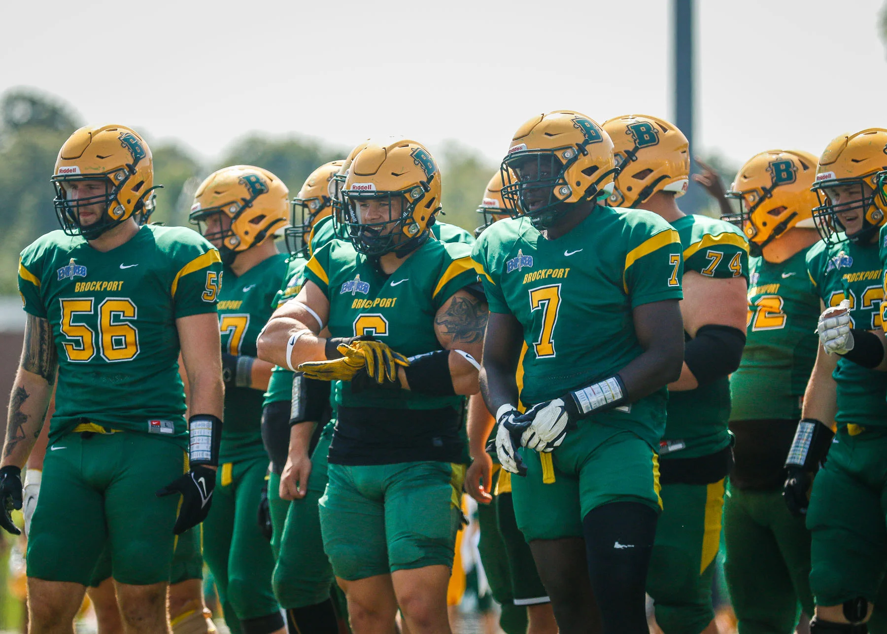 Brockport players cheering on teammates during the scrimmage