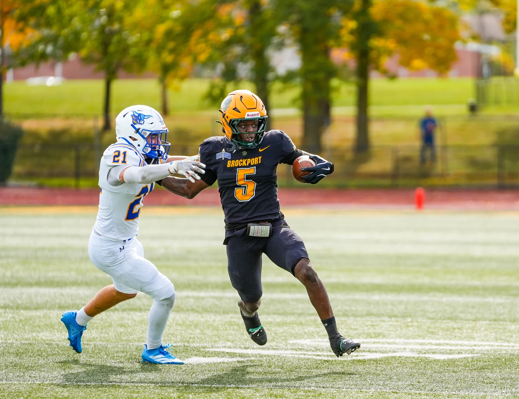 WR stiff arming the DB