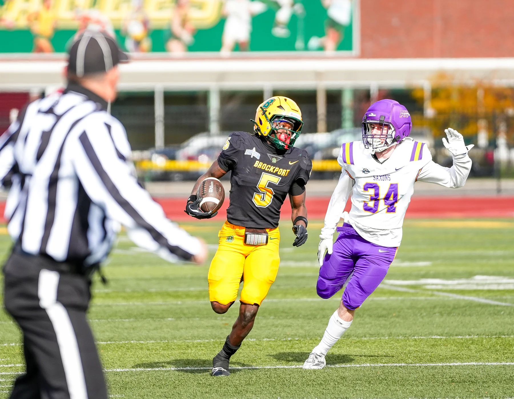 WR racing down the field with the ball