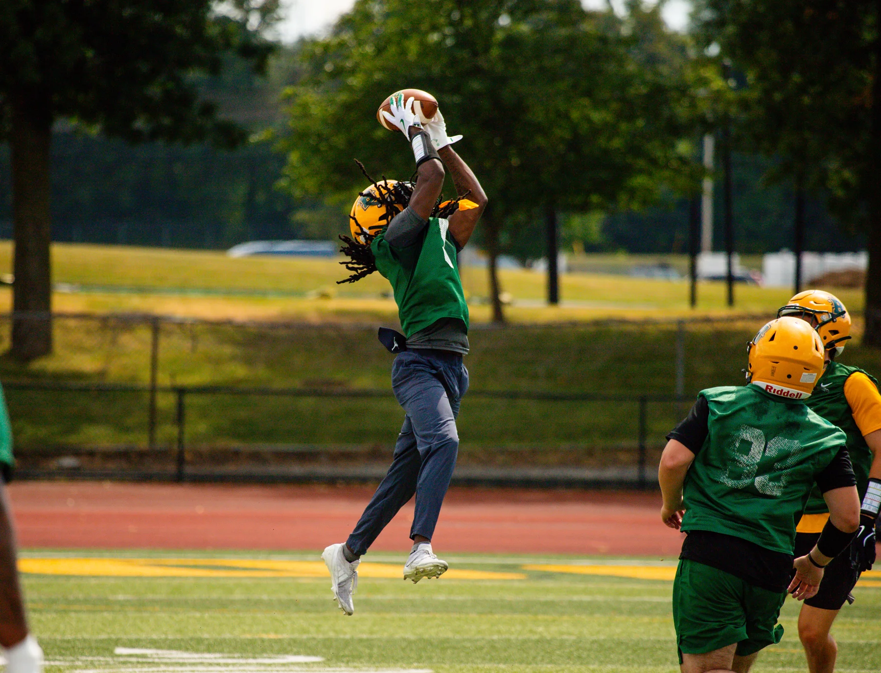 DB going up for the ball and making the catch