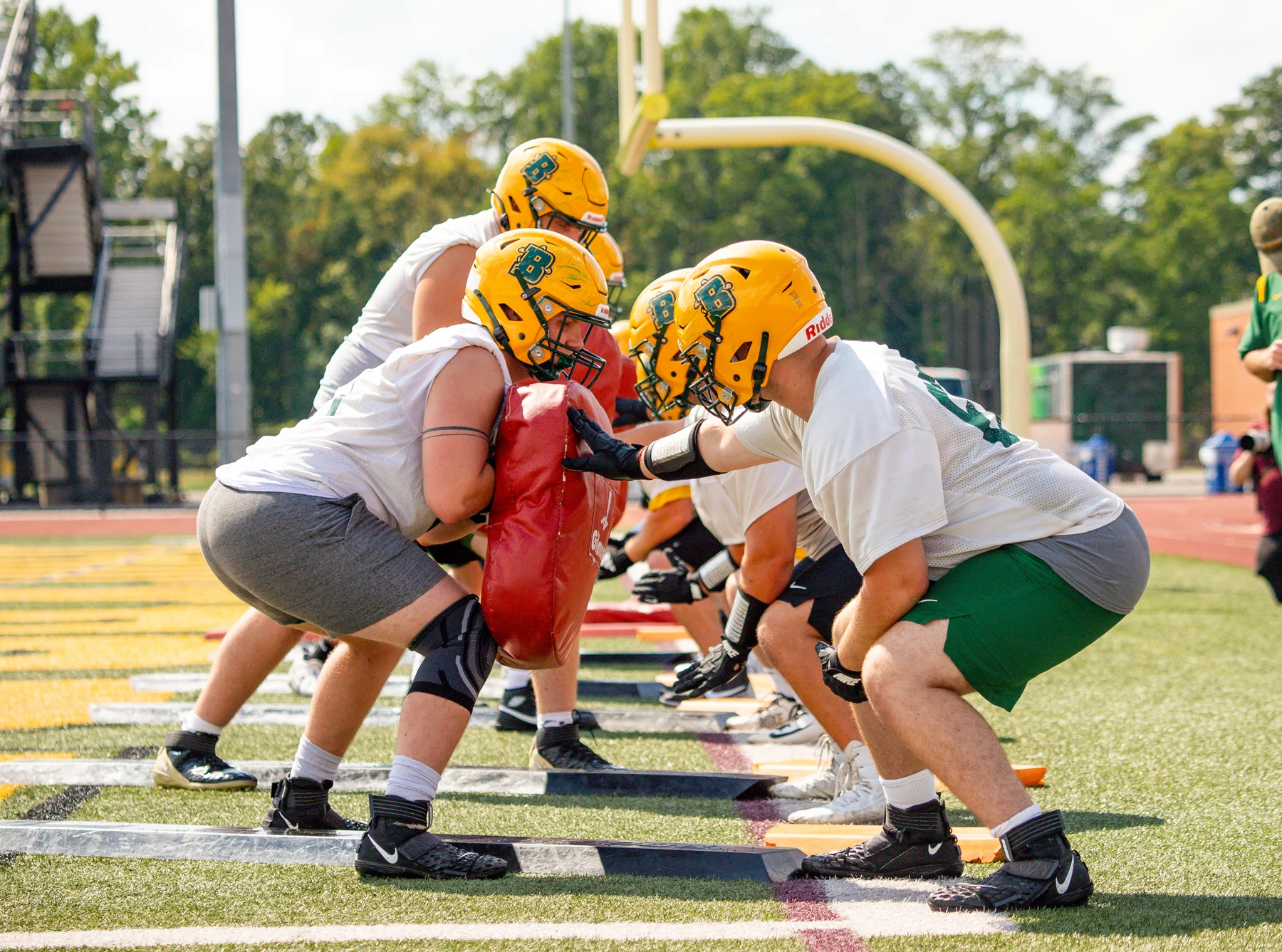 Brockport Football OL setting the blocks in the drill