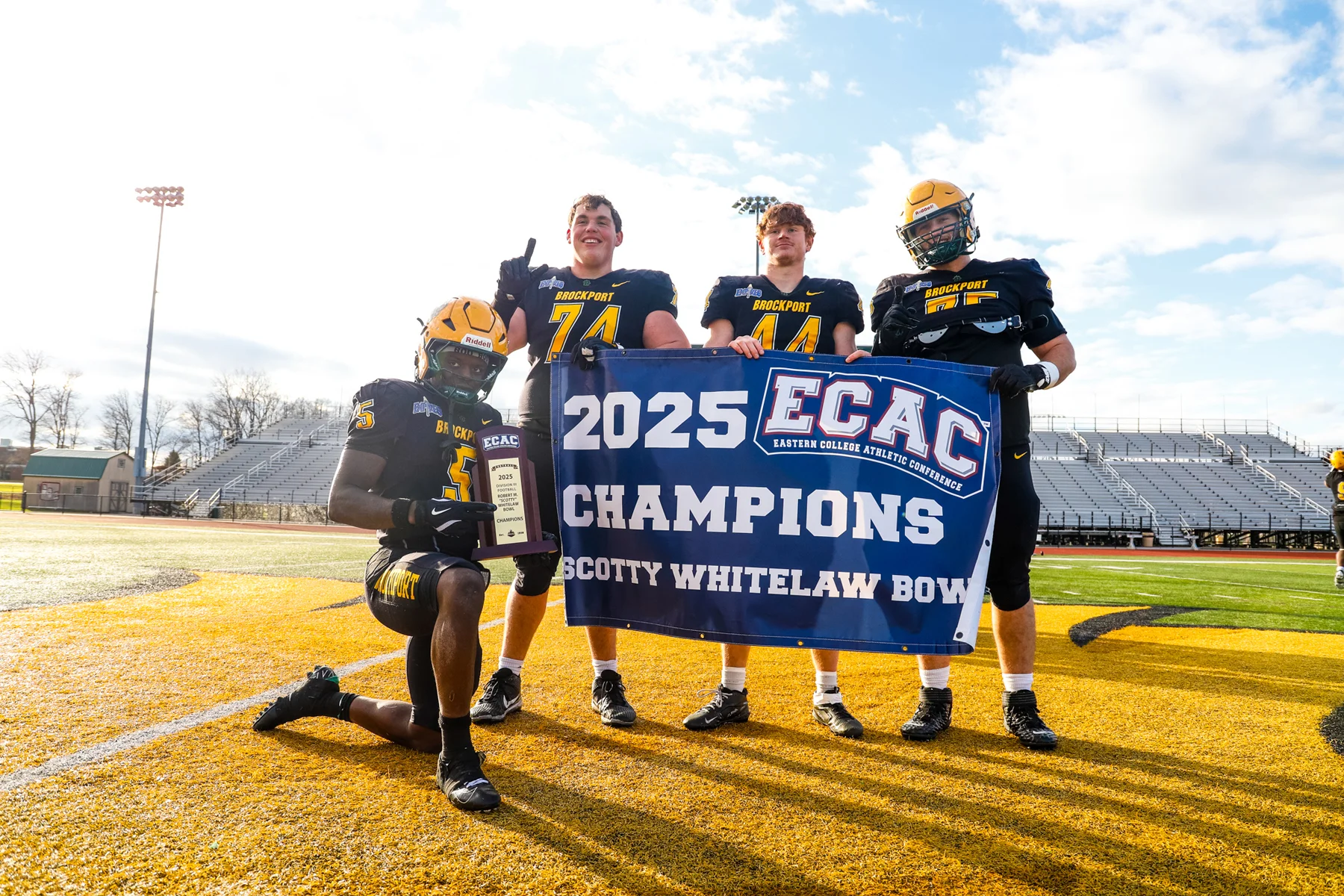4 Seniors with the banner