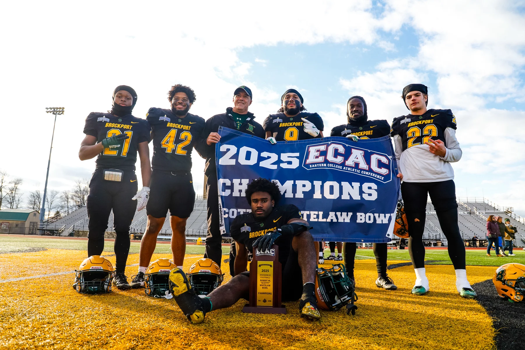 RB's with the banner after the win