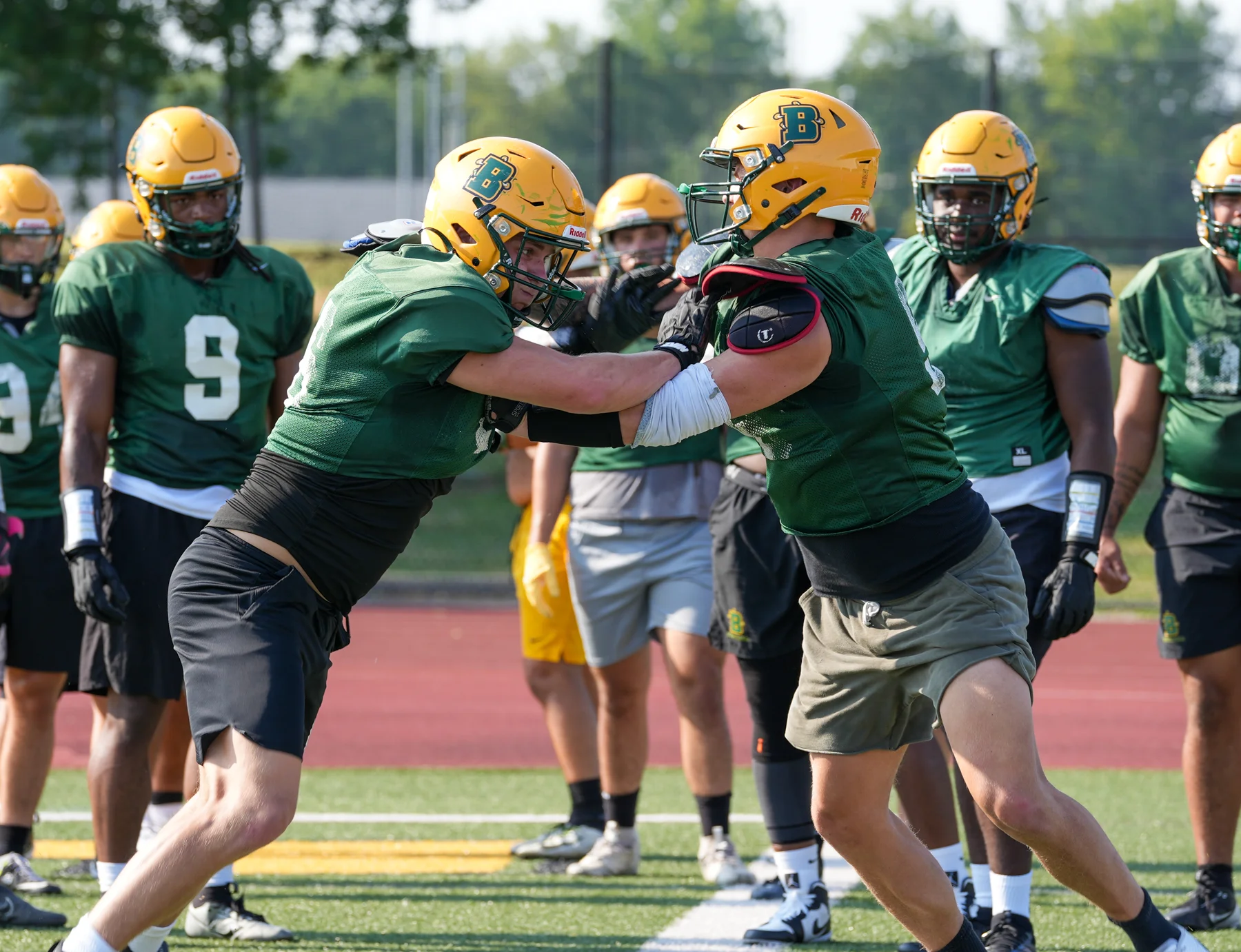 Brockport Football players in blocking drills