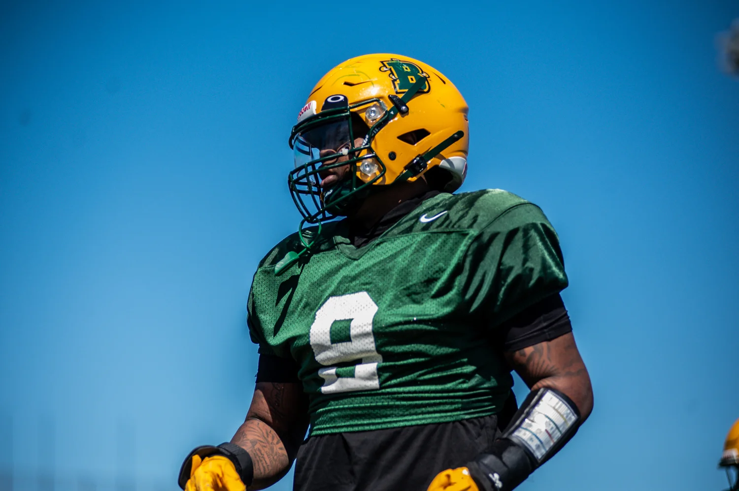 Brockport Football player against the blue sky