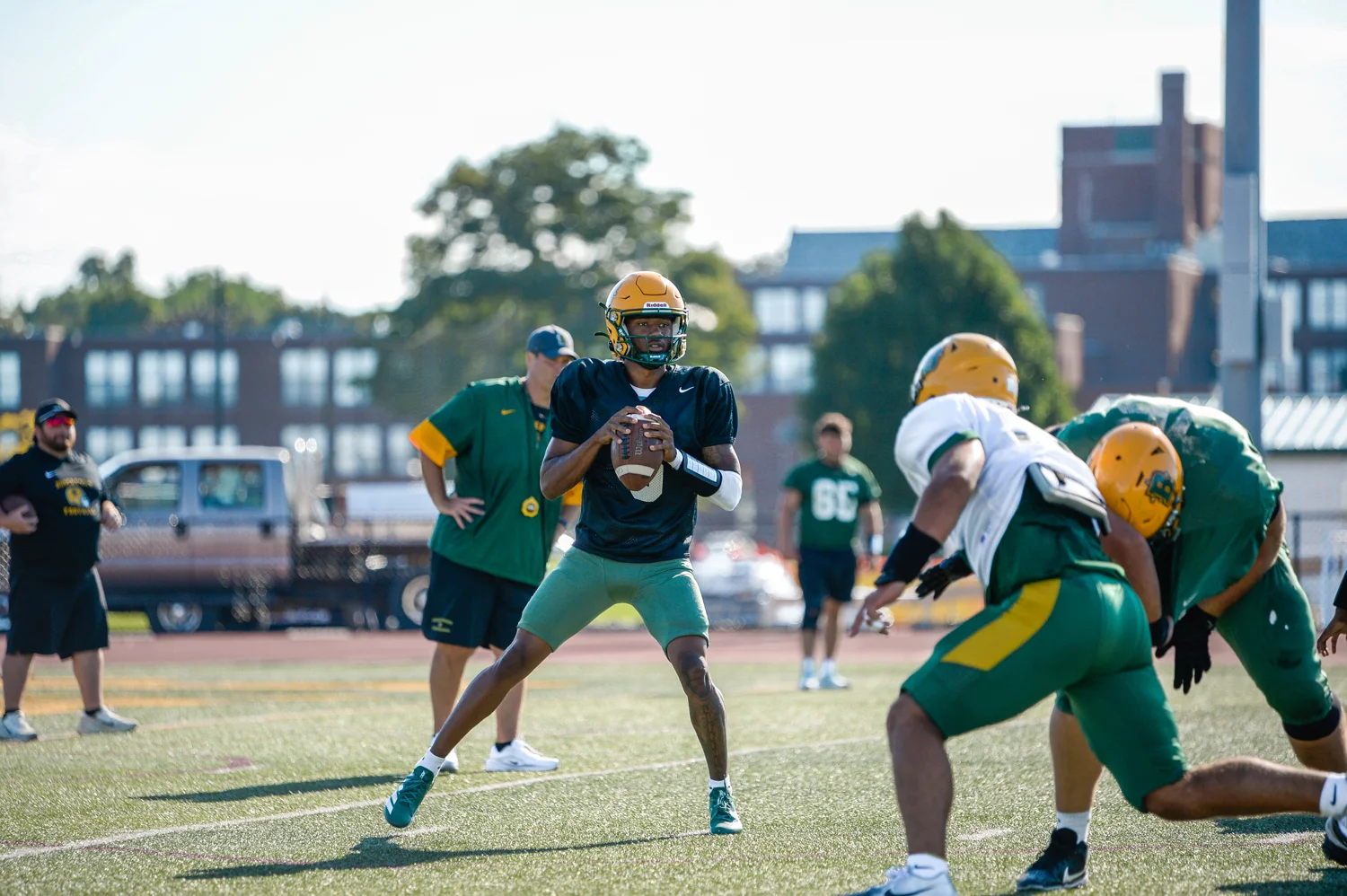Brockport QB going back for a pass