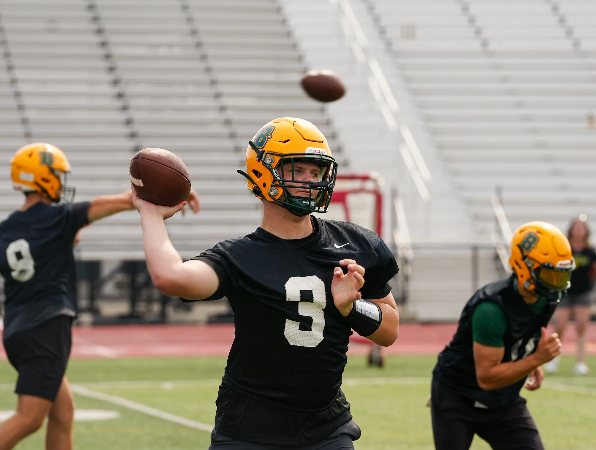 QB throwing the ball during the first outdoor practice