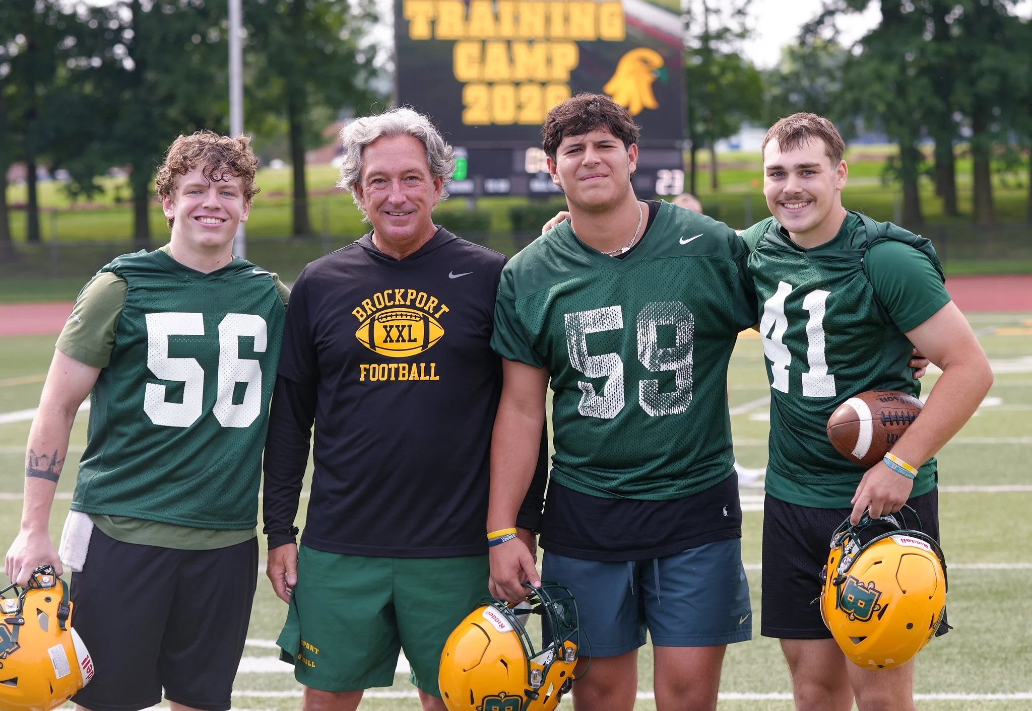 Coach with Brockport all smiles during practice