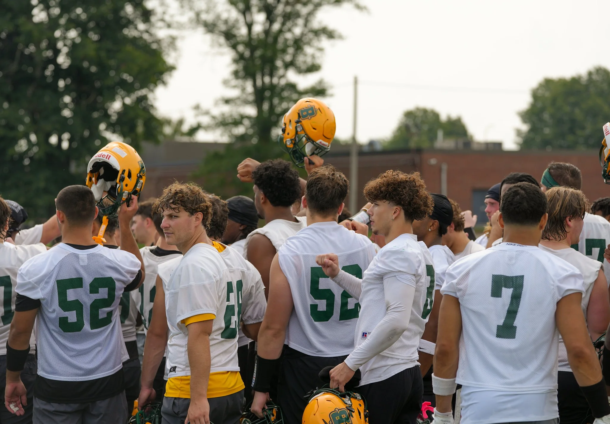 Brockport players in a huddle during practice
